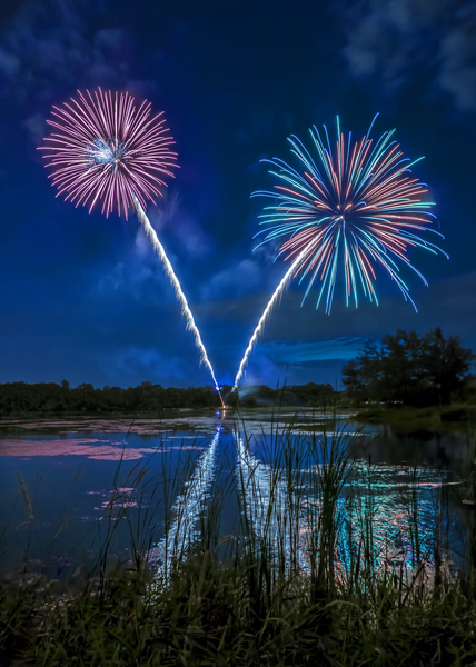 Reflections of fireworks by Jim Radford