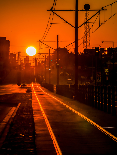 Sunset on tracks by Jim Radford